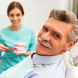 An older man about to receive dentures