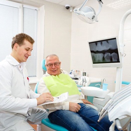 Dentist and patient reviewing treatment plan